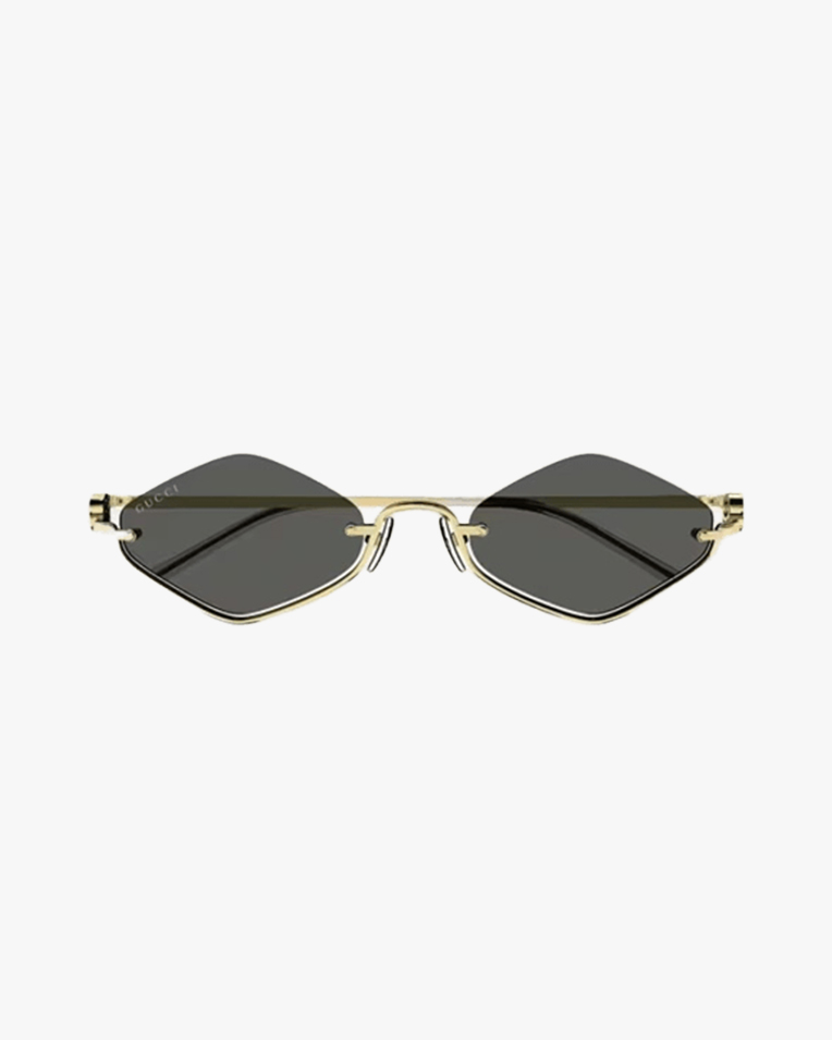 Солнцезащитные очки ромбы Gucci Geometric в золотой оправе c серой линзой GG1604S 001