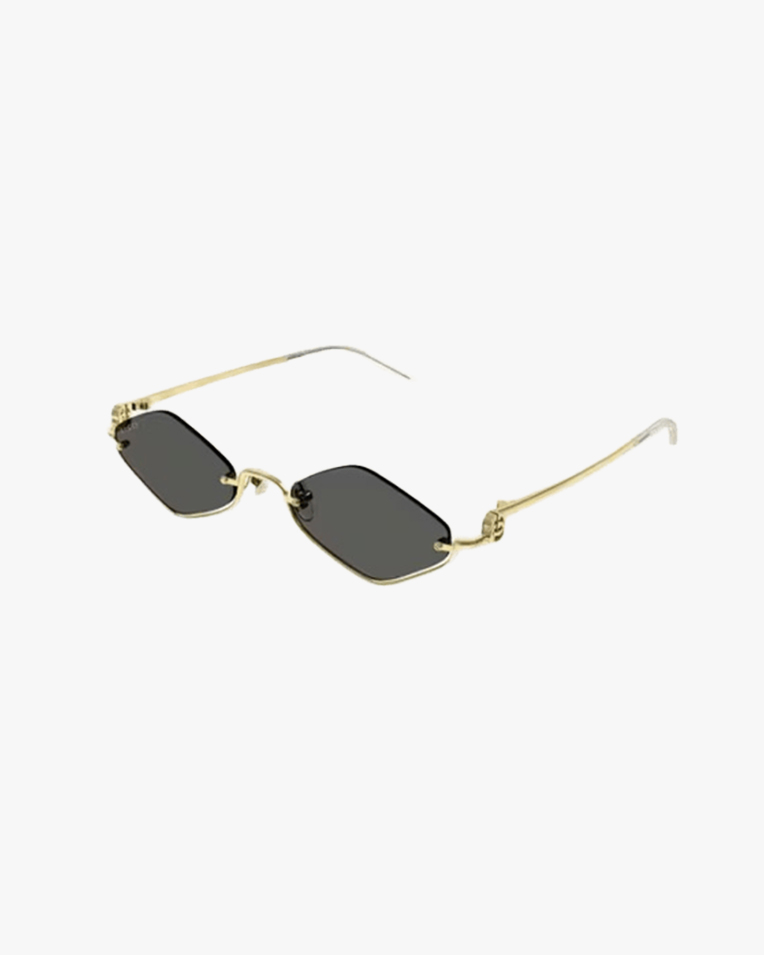 Солнцезащитные очки ромбы Gucci Geometric в золотой оправе c серой линзой GG1604S 001