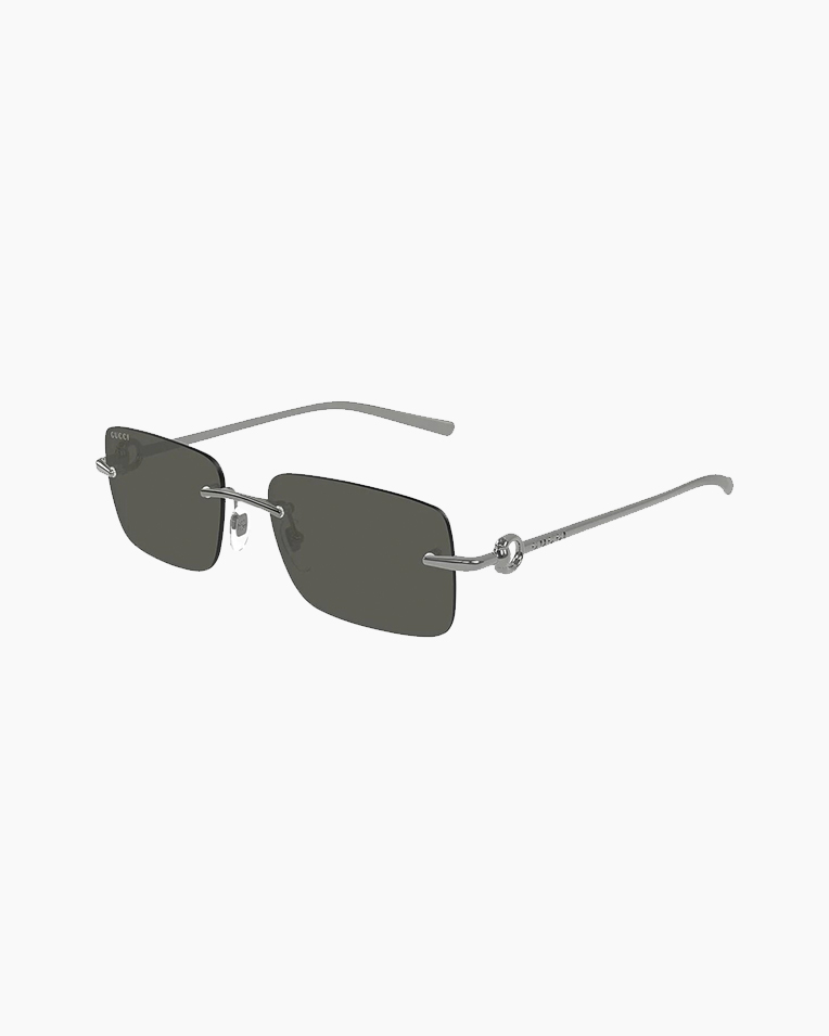 Солнцезащитные очки прямоугольные Gucci Rimless в серой оправе GG1703-001